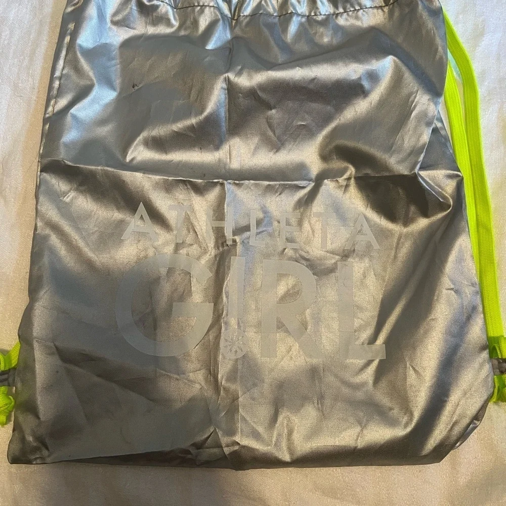 Athletta girl silver and neon green  cinch sack. Used, but life left in it.